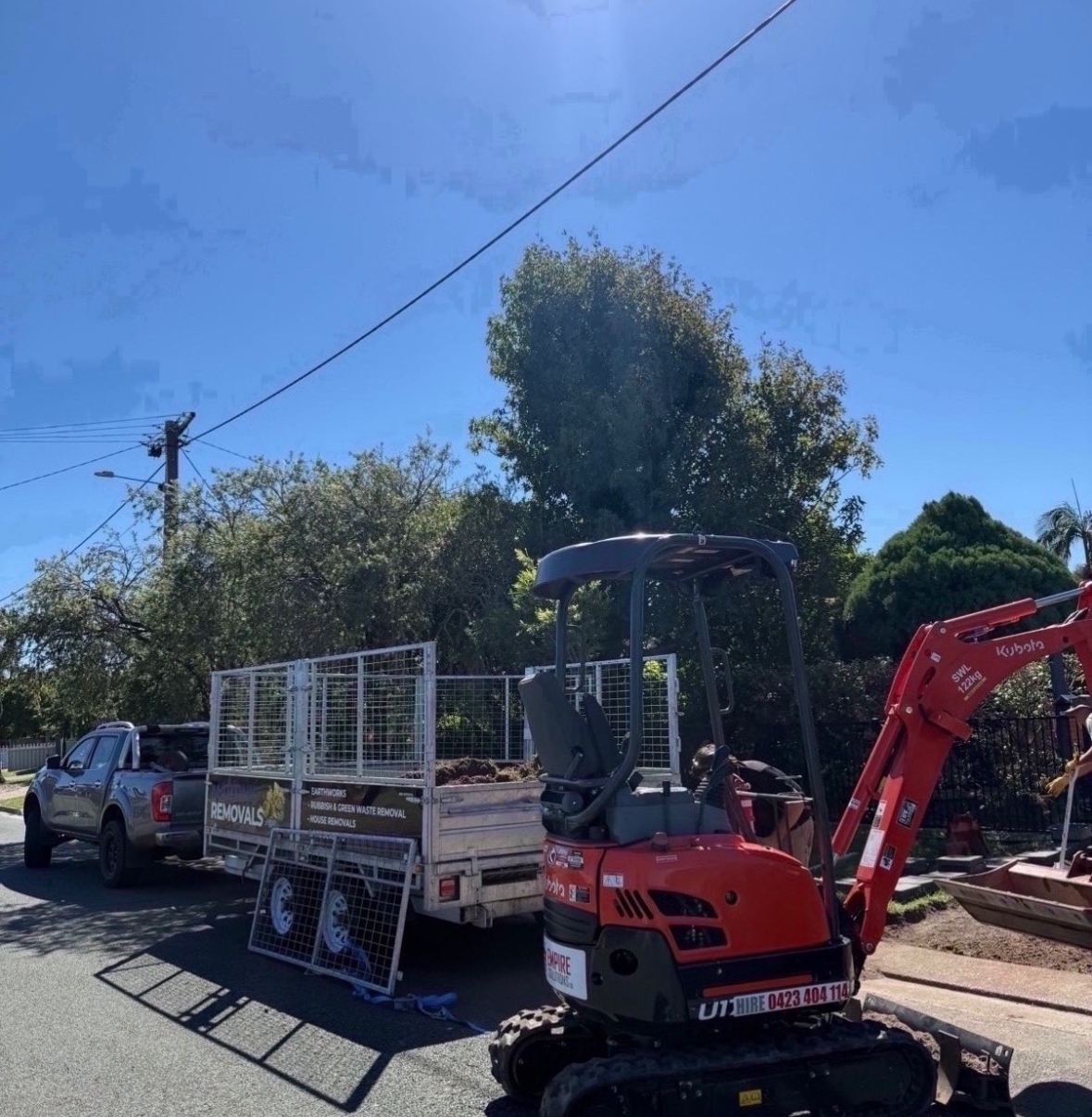 Kubota excavator and Martin's removals trailer on site